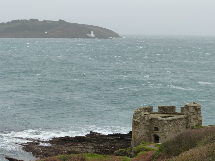A glimpse of Pendennis Castle and the waves taking a battering